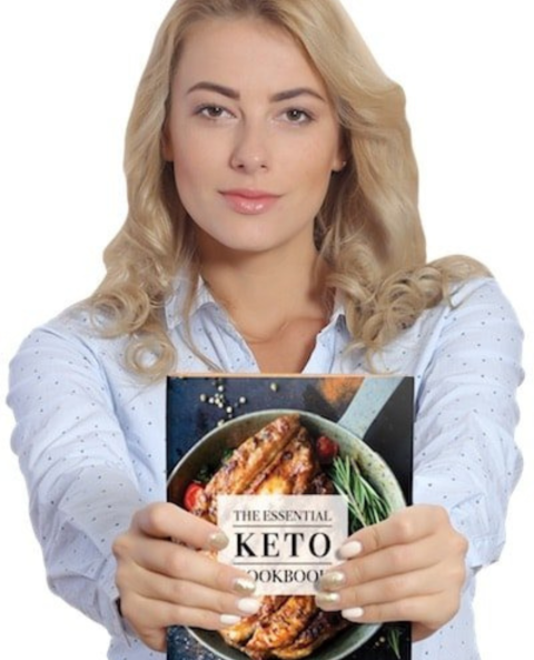 A Woman Holding - The Essential Keto Cookbook.